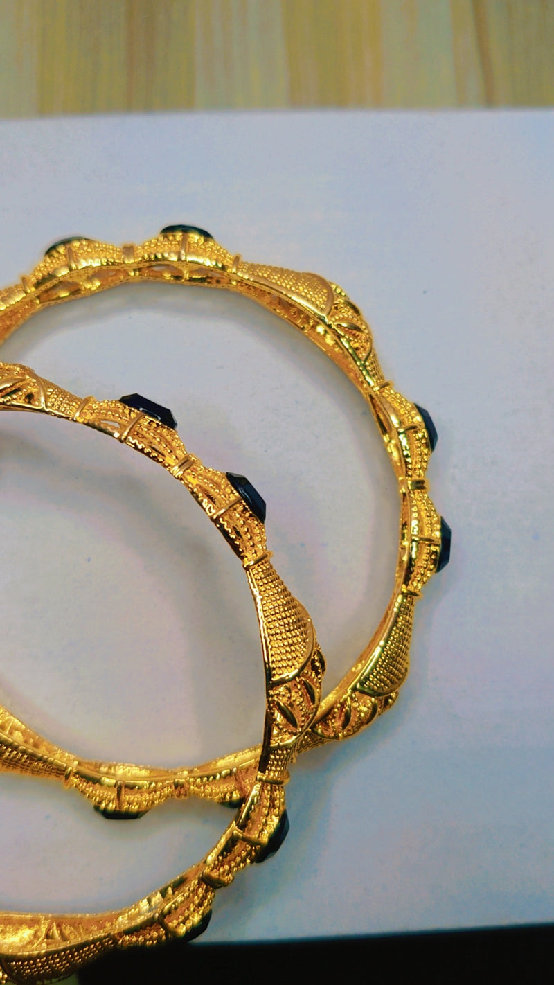 Gold-toned bangles with black zircon stones – stylish addition to Zivaya’s elegant jewelry sets in Pakistan